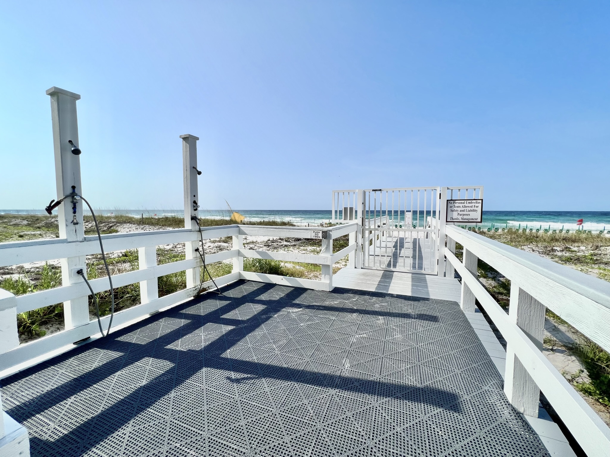 Sterling Sands boardwalk with beach showers leading to the Gulf
